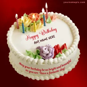 white birthday cake with glowing candles